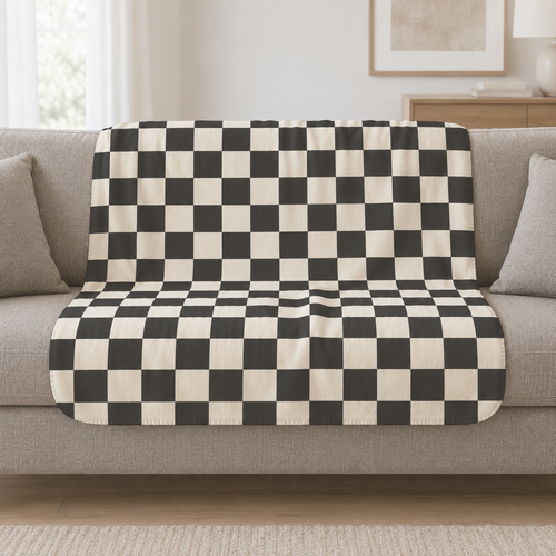 Black and White Checkered Sherpa Blanket draped over a cream sofa in a living room