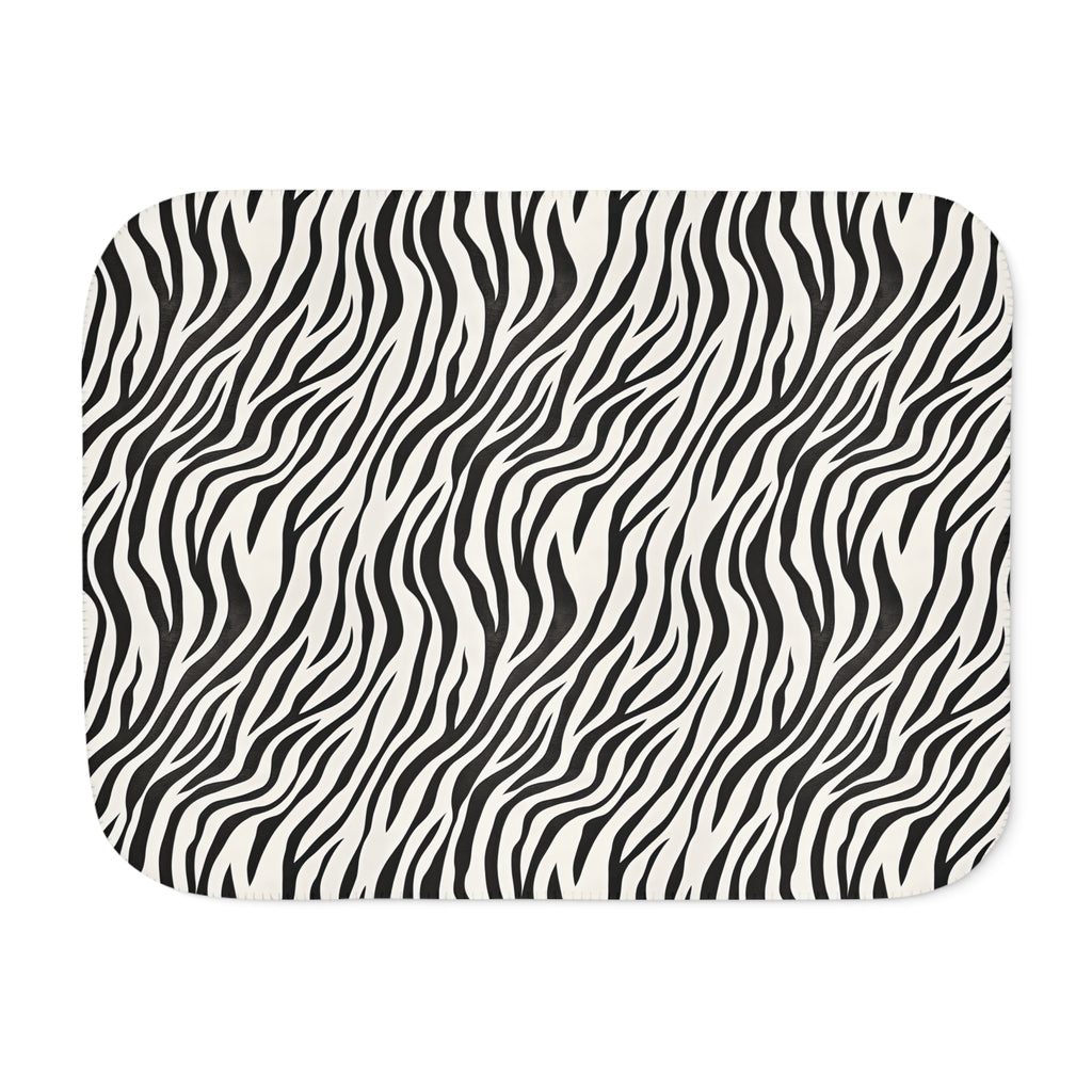 Black and white zebra print sherpa blanket laid flat, front view