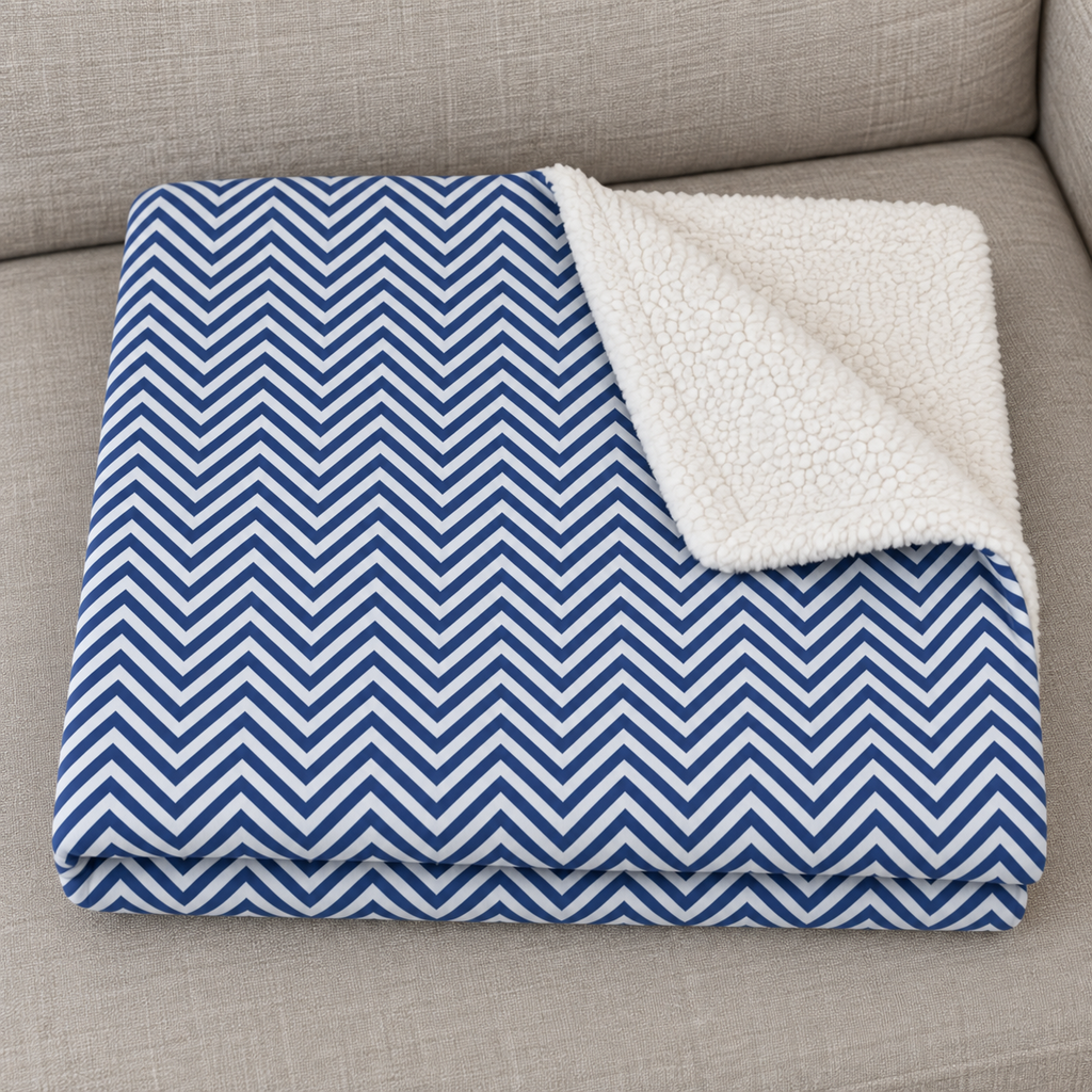 Close-up of the folded Blue Herringbone Sherpa Blanket showing the sherpa back