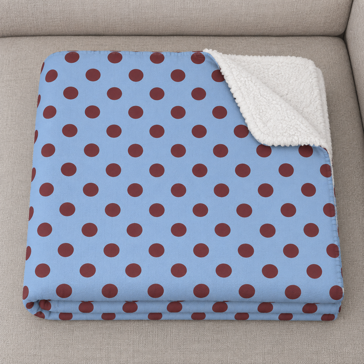 Close-up of the folded Blue Polka Dot Sherpa Blanket showing the sherpa back