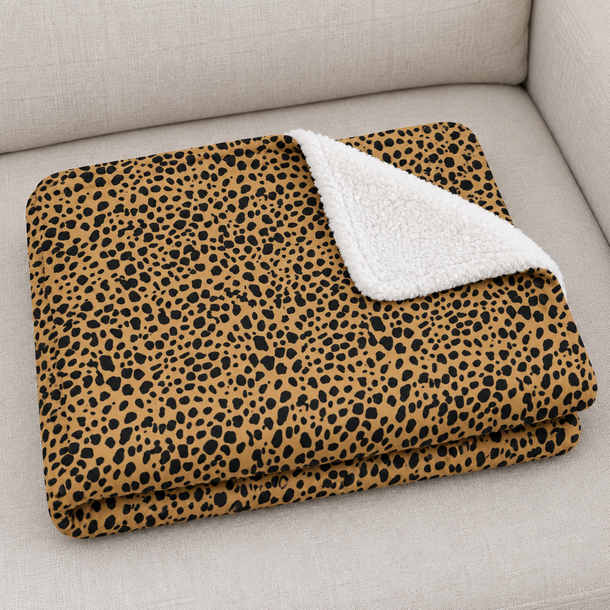 Close-up of the folded Brown Cheetah Print Sherpa Blanket showing the sherpa back