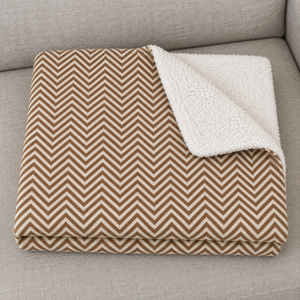 Close-up of the folded Brown Herringbone Sherpa Blanket showing the sherpa back
