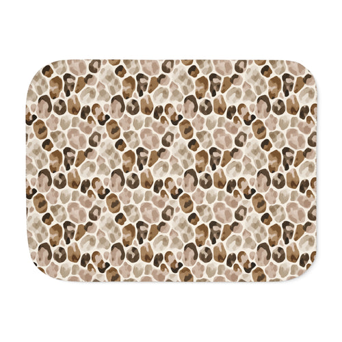 Brown leopard print sherpa blanket laid flat, showing open camel, tan and soft brown rosettes with a white sherpa edge