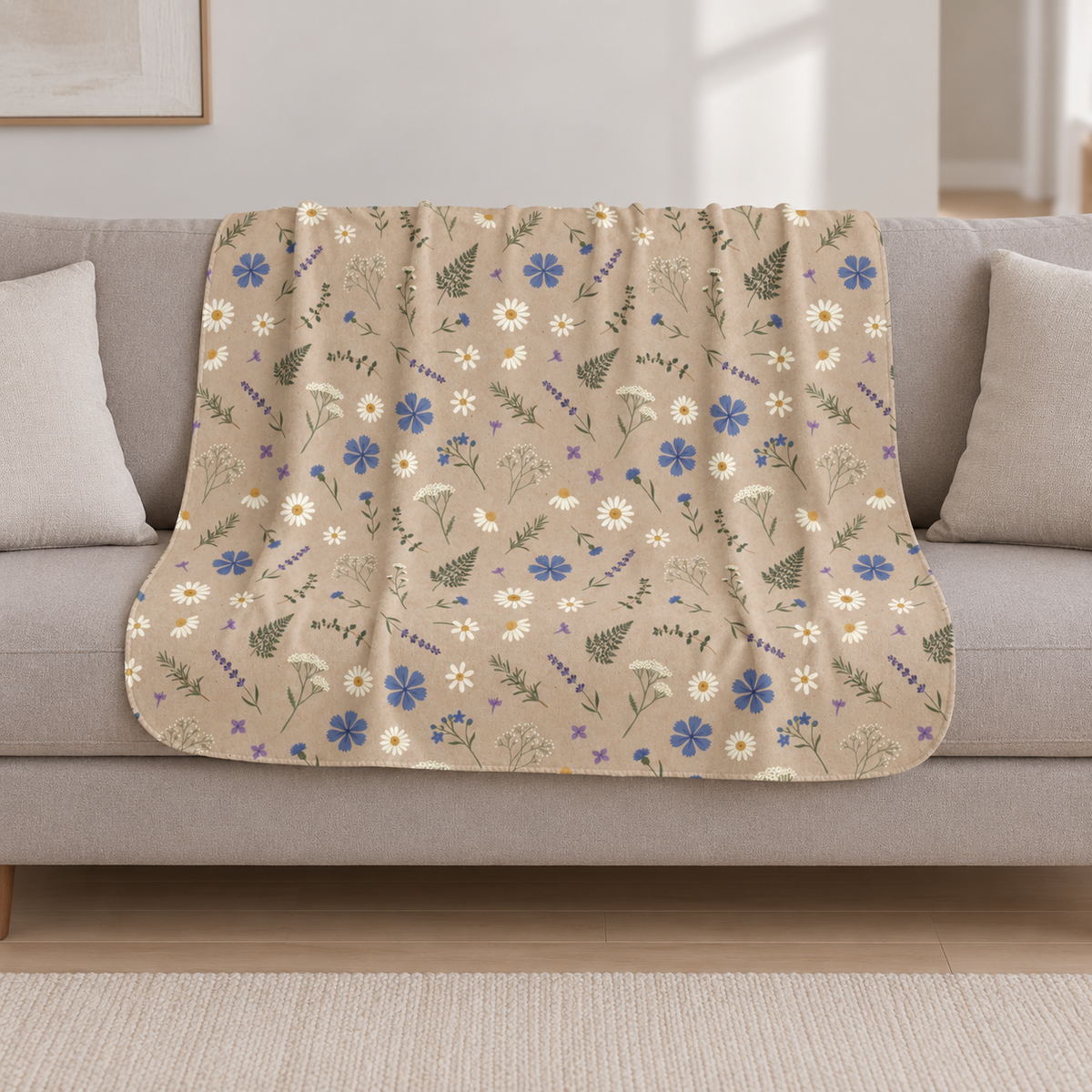 Brown Wildflower Sherpa Blanket draped over a cream sofa in a living room