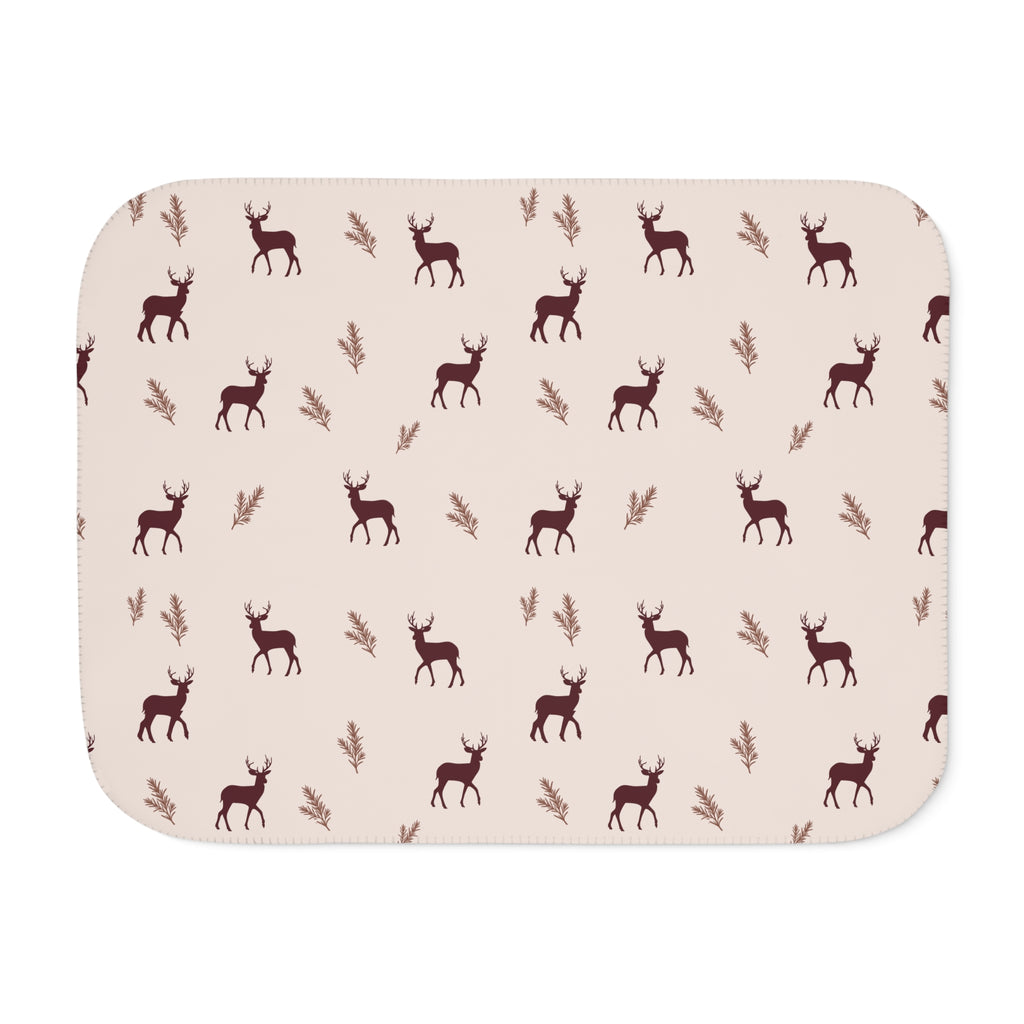 Burgundy deer print sherpa blanket laid flat, front view