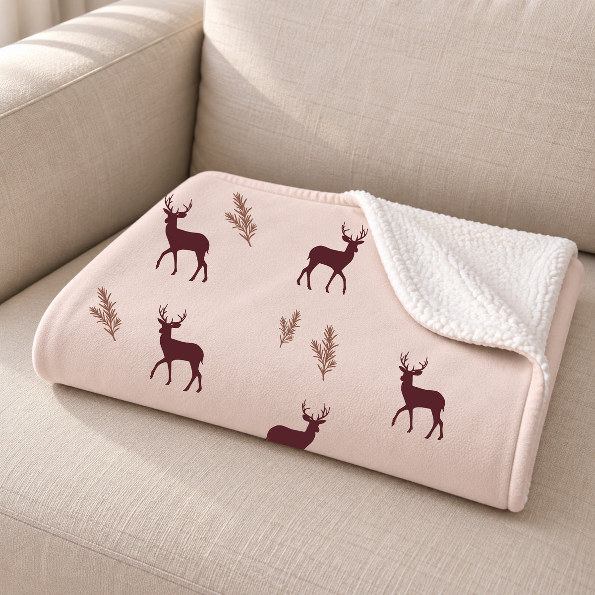 Close-up of the folded burgundy deer print sherpa blanket showing the sherpa back