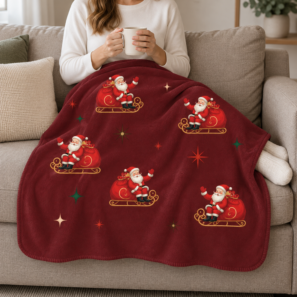 Person relaxing on a couch under the Burgundy Retro Santa Christmas Sherpa Blanket