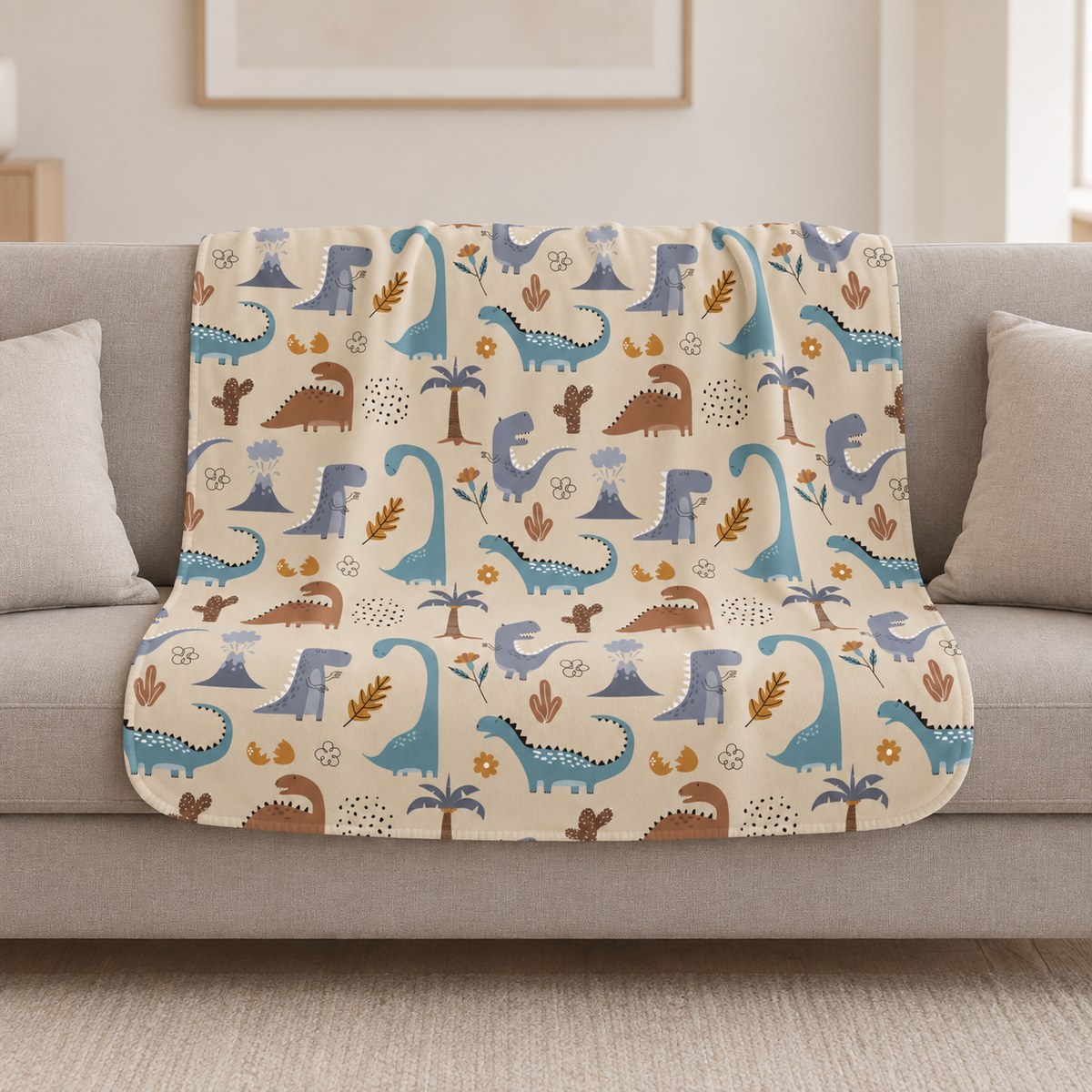 Cream Dinosaur Sherpa Blanket draped over a cream sofa in a living room