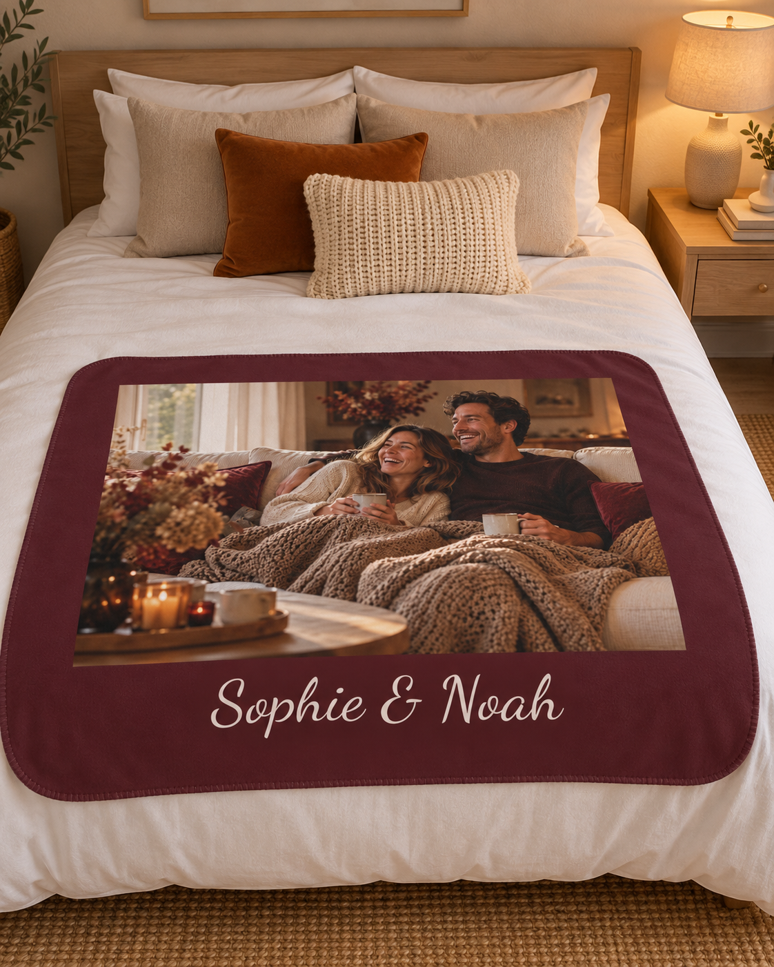 Custom photo blanket in burgundy with one photo and text, on a bed