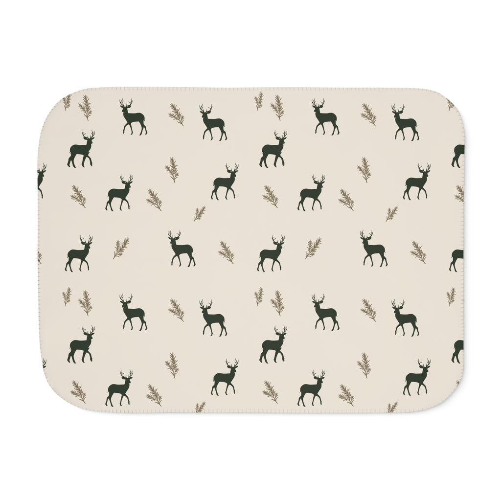 Green deer print sherpa blanket laid flat, front view