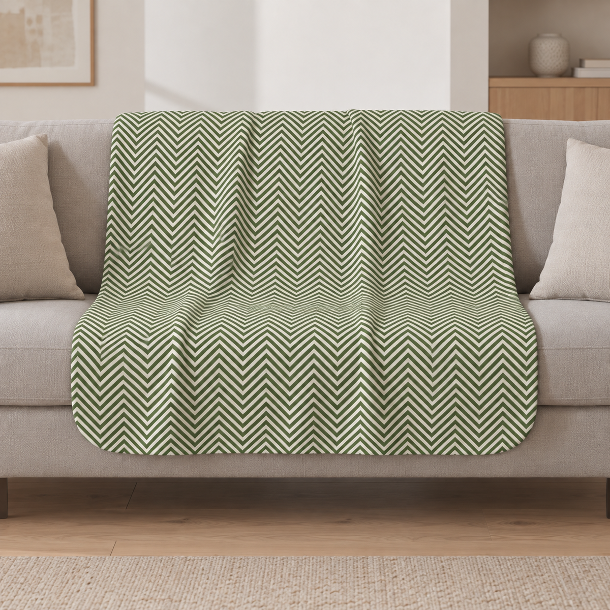 Green Herringbone Sherpa Blanket draped over a cream sofa in a living room