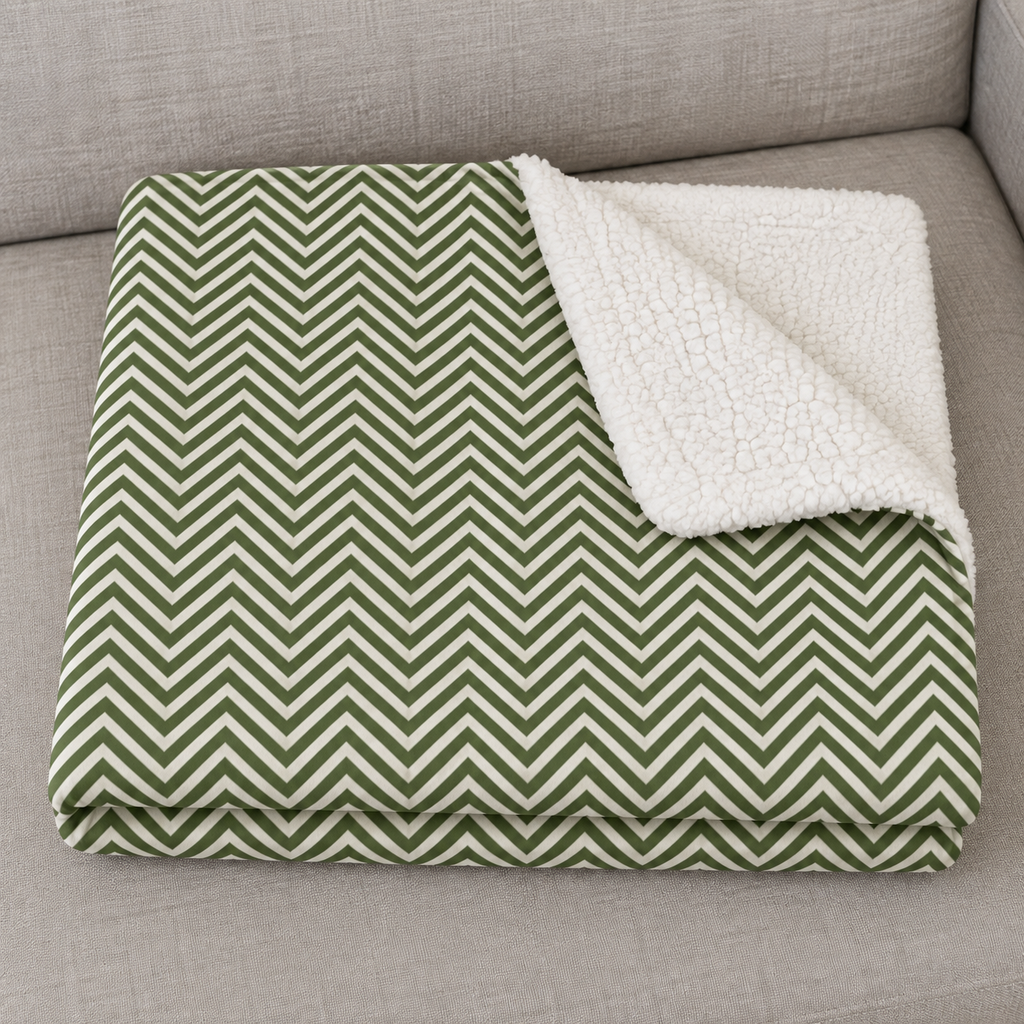 Close-up of the folded Green Herringbone Sherpa Blanket showing the sherpa back