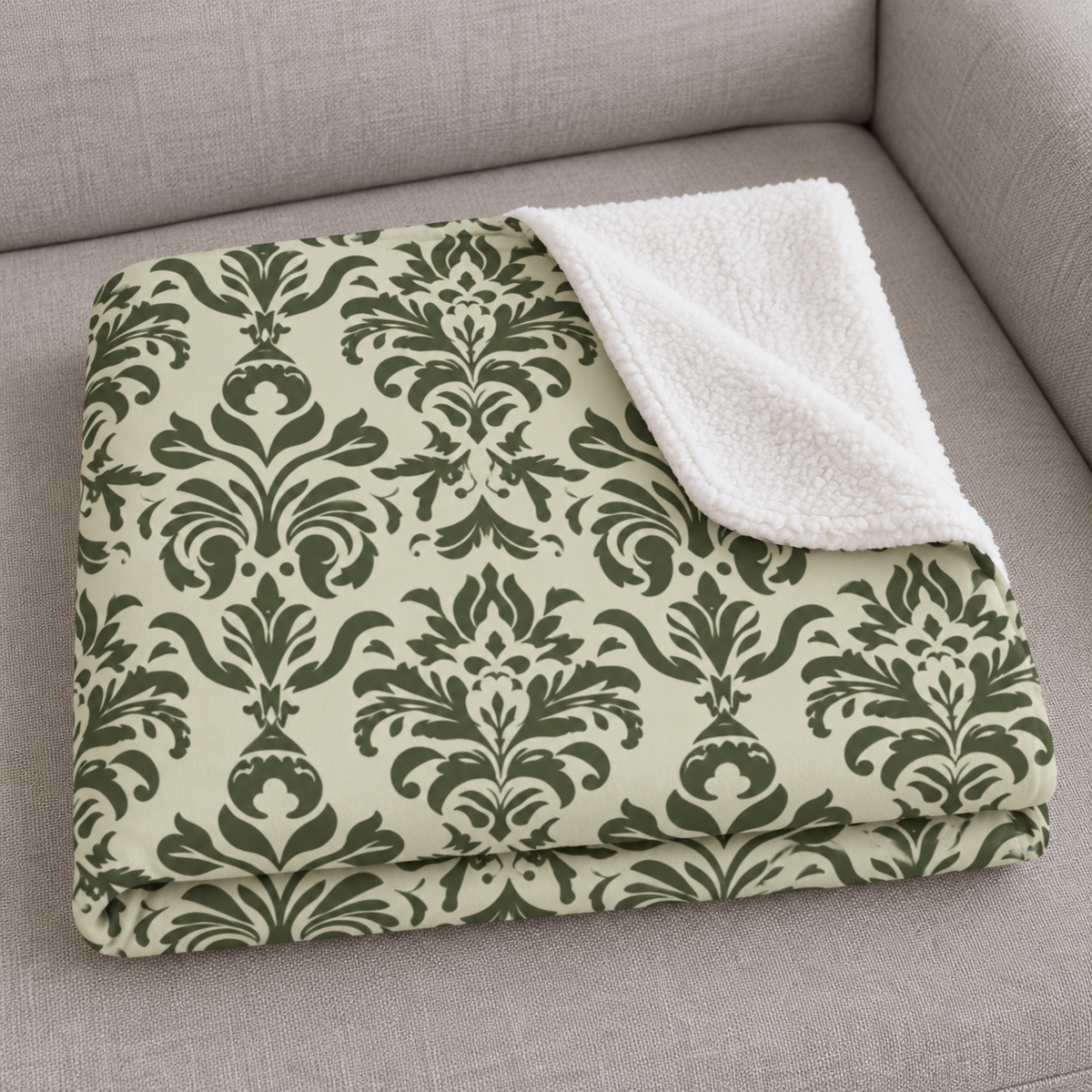 Close-up of the folded Green Tapestry Sherpa Blanket showing the sherpa back