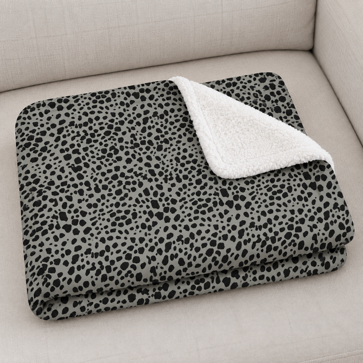 Close-up of the folded Grey Cheetah Print Sherpa Blanket showing the sherpa back