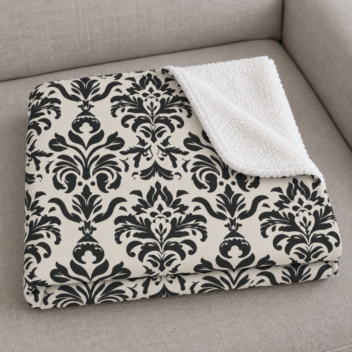 Close-up of the folded Grey Tapestry Sherpa Blanket showing the sherpa back