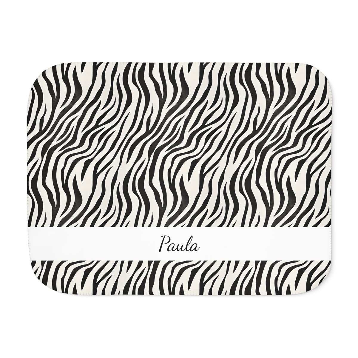 Personalized black and white zebra print sherpa blanket with name, front view with name band