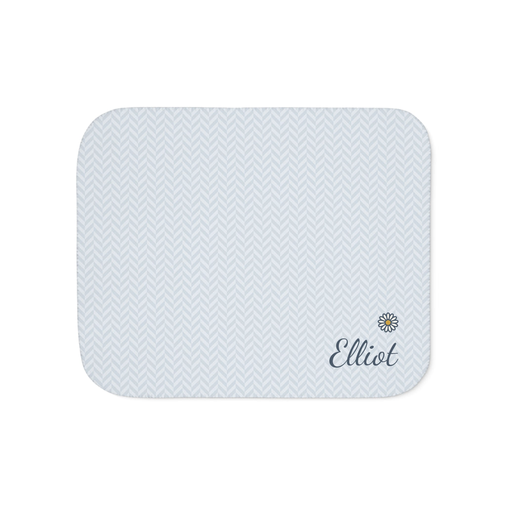 Personalized blue baby blanket with name and a flower, front view with name and flower
