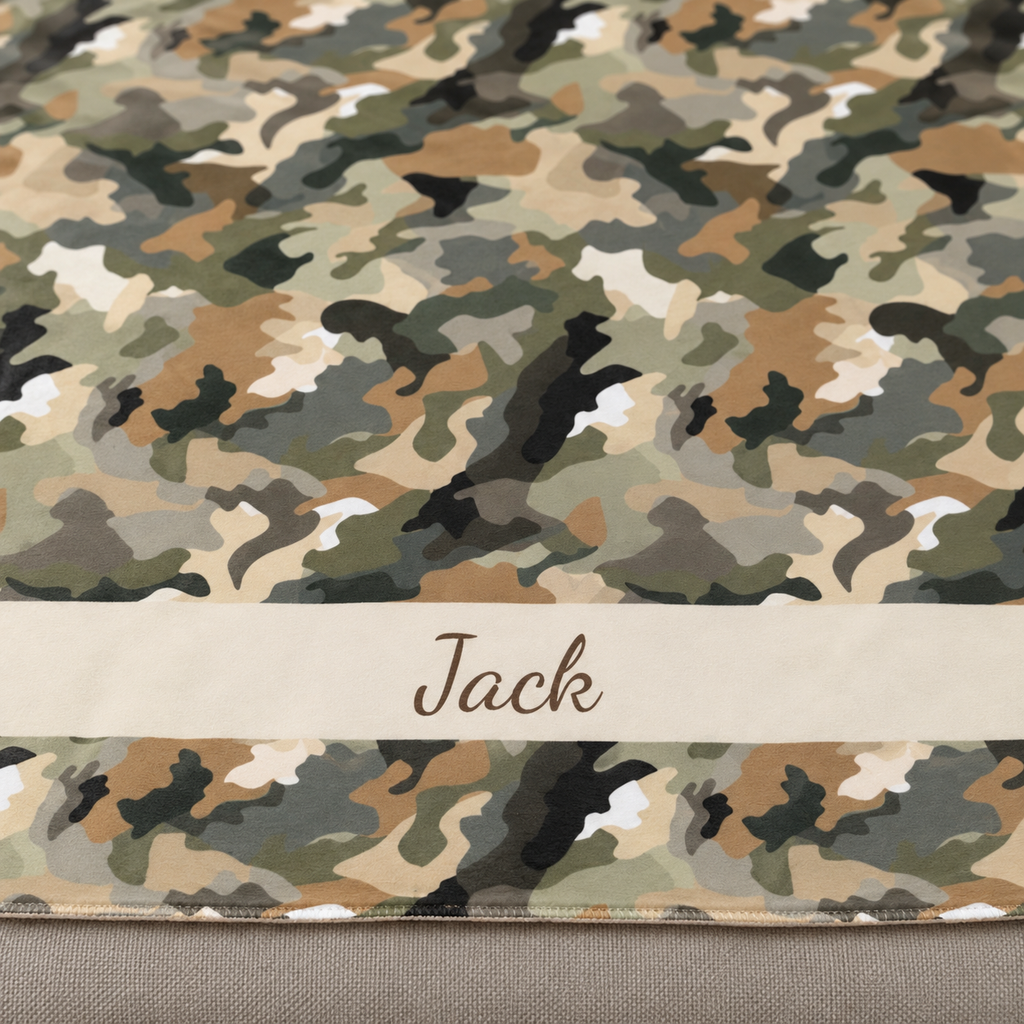 Personalized brown camo sherpa blanket with name, close-up of the name in script on the band