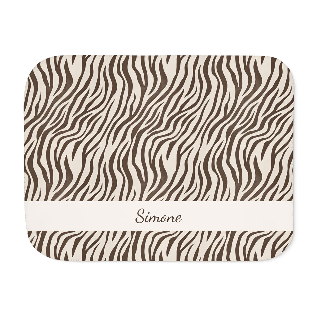 Personalized brown zebra print sherpa blanket with name, front view with name band