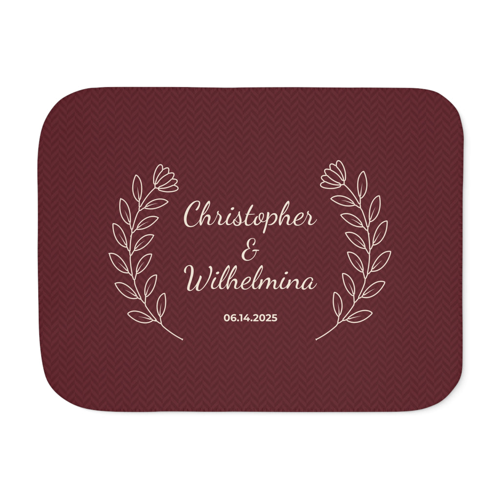 Personalized burgundy sherpa blanket with two names and a date, front view with two names and a date
