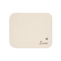 Personalized cream baby blanket with name and a flower, front view with name and flower