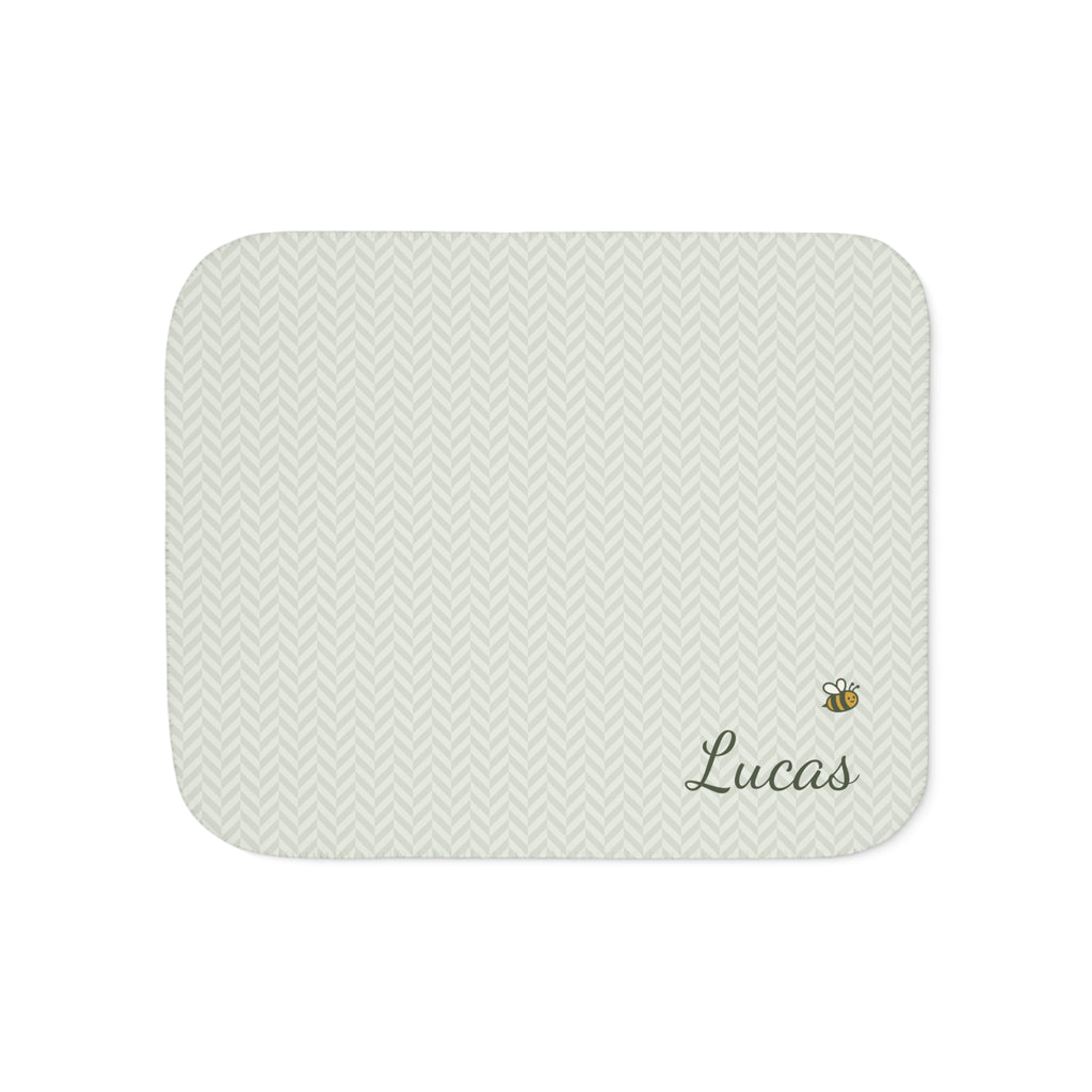 Personalized green baby blanket with name and a bee, front view with name and bee