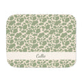 Personalized green cow print sherpa blanket with name, front view with name band