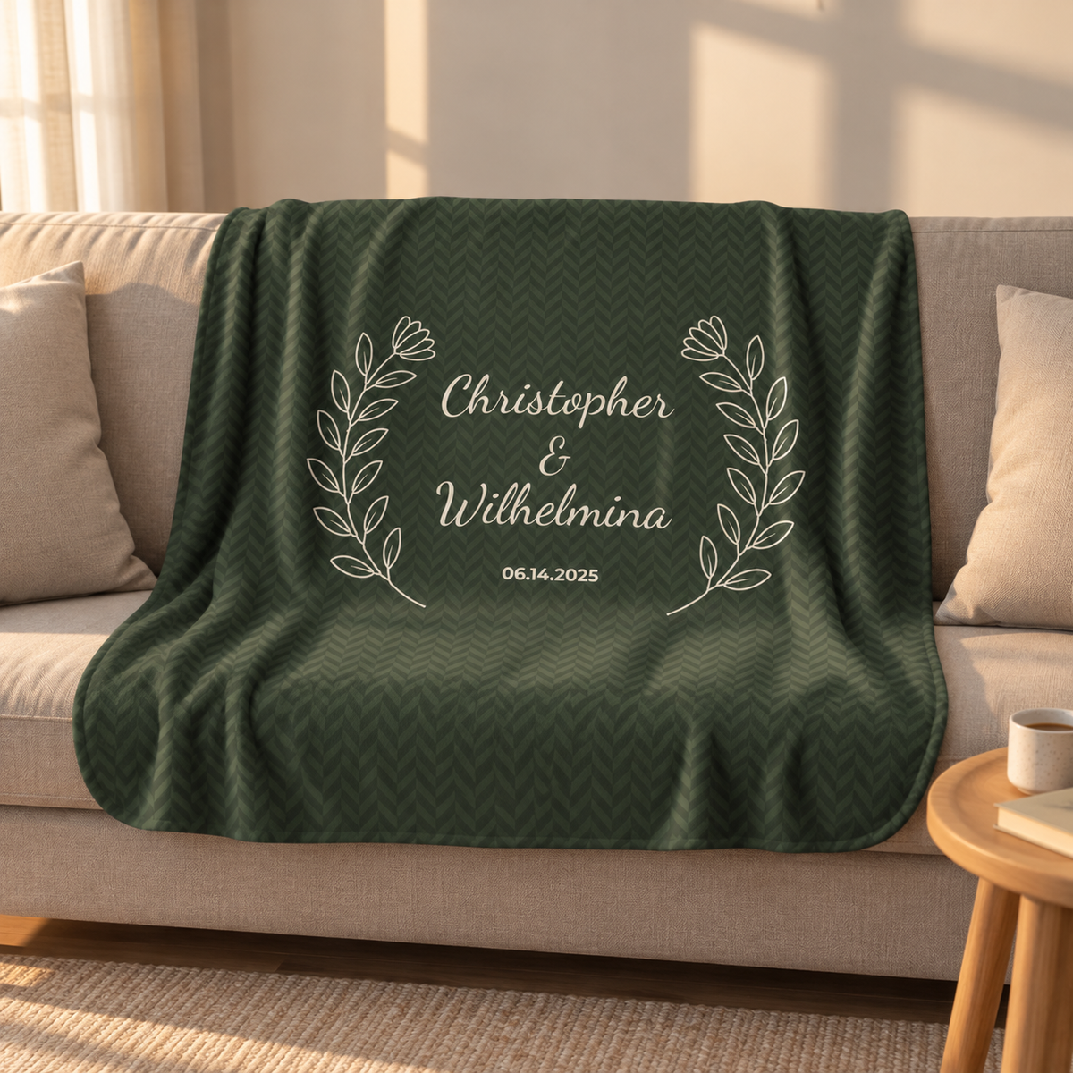 Personalized green sherpa blanket with two names and a date, draped over a couch