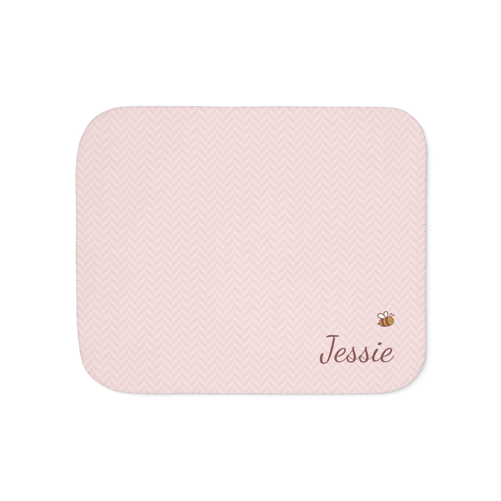 Personalized pink baby blanket with name and a bee, front view with name and bee