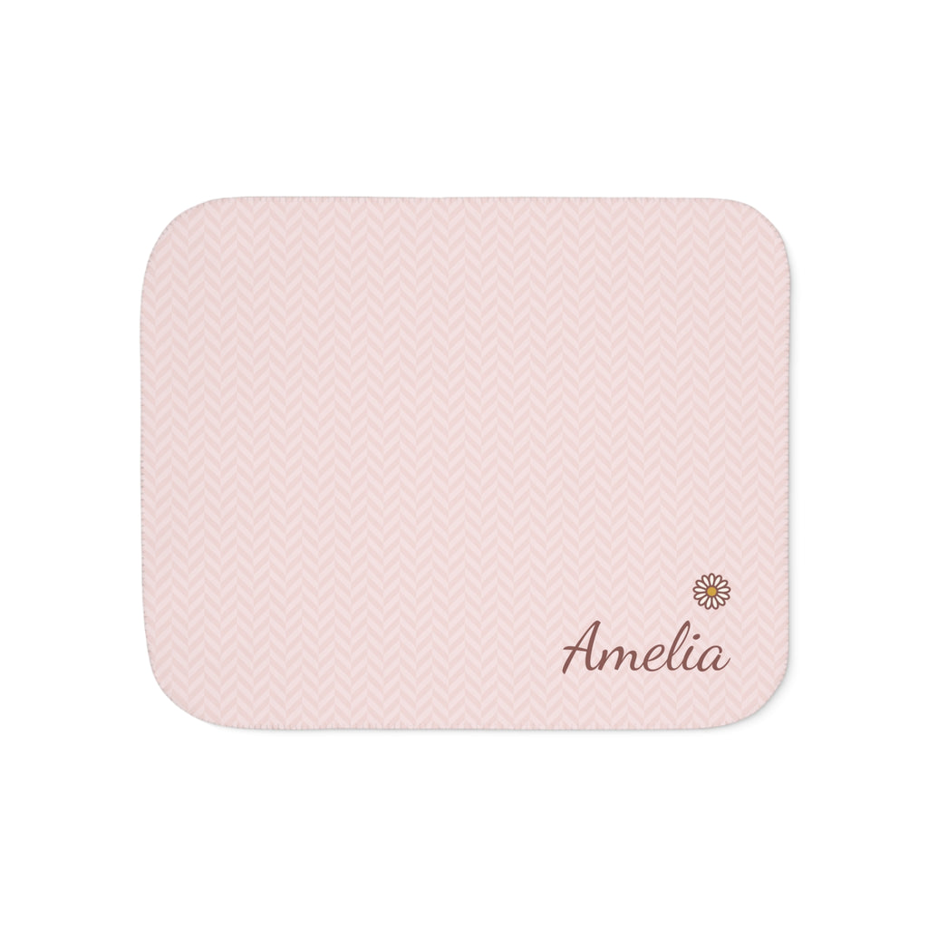 Personalized pink baby blanket with name and a flower, front view with name and flower