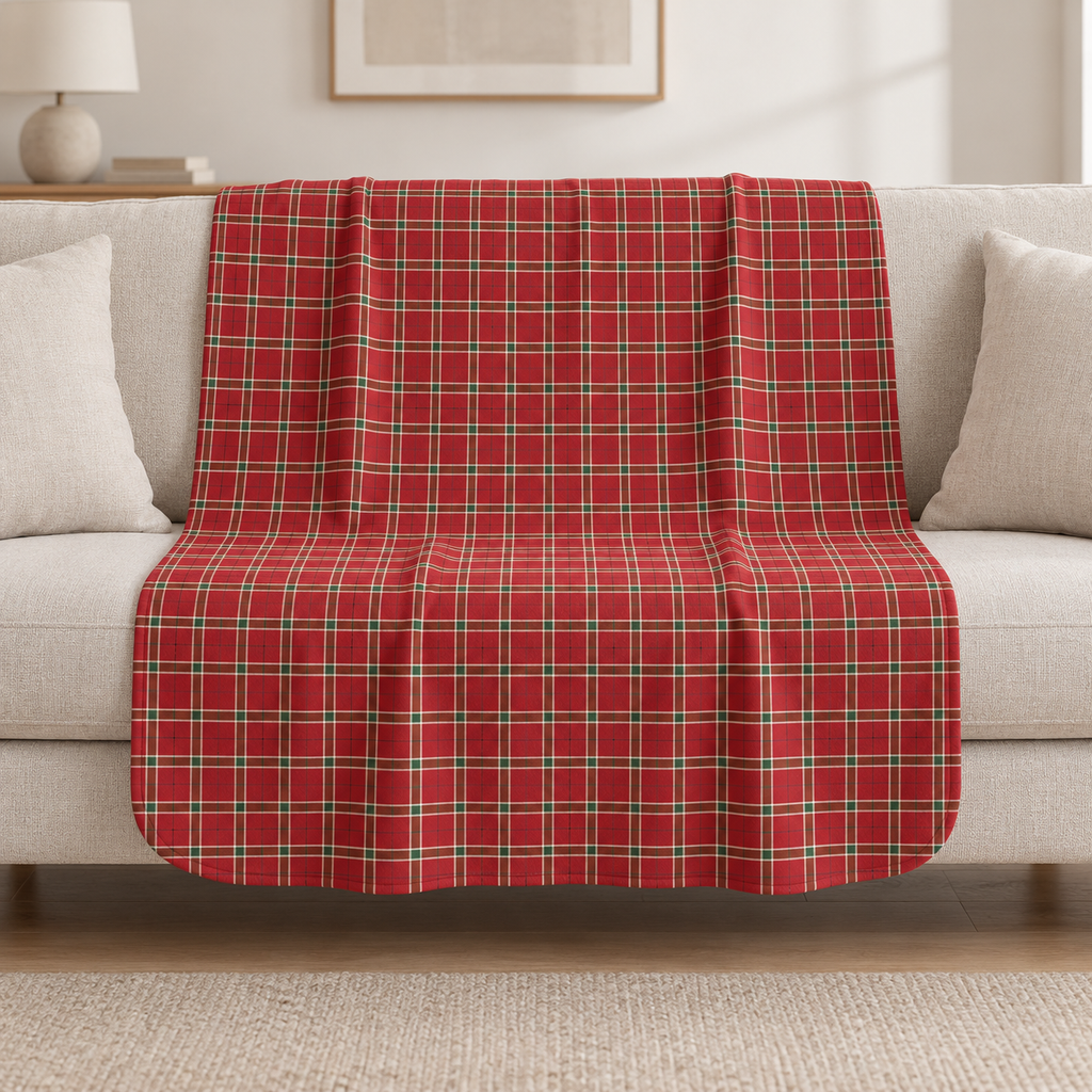 Red Plaid Sherpa Blanket draped over a cream sofa in a living room